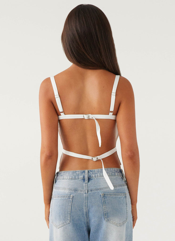 Womens Naomi Backless Top in the colour White in front of a light grey background