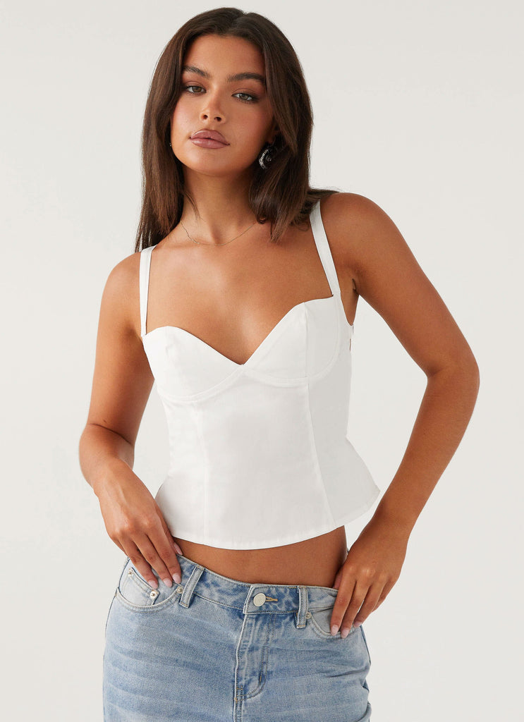 Womens Naomi Backless Top in the colour White in front of a light grey background