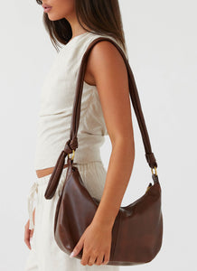 Womens Tana Shoulder Bag in the colour Brown in front of a light grey background