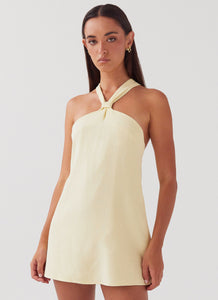 Womens Keira Linen Mini Dress in the colour Lemon in front of a light grey background