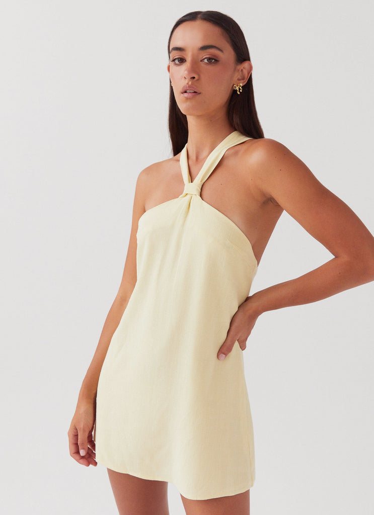 Womens Keira Linen Mini Dress in the colour Lemon in front of a light grey background