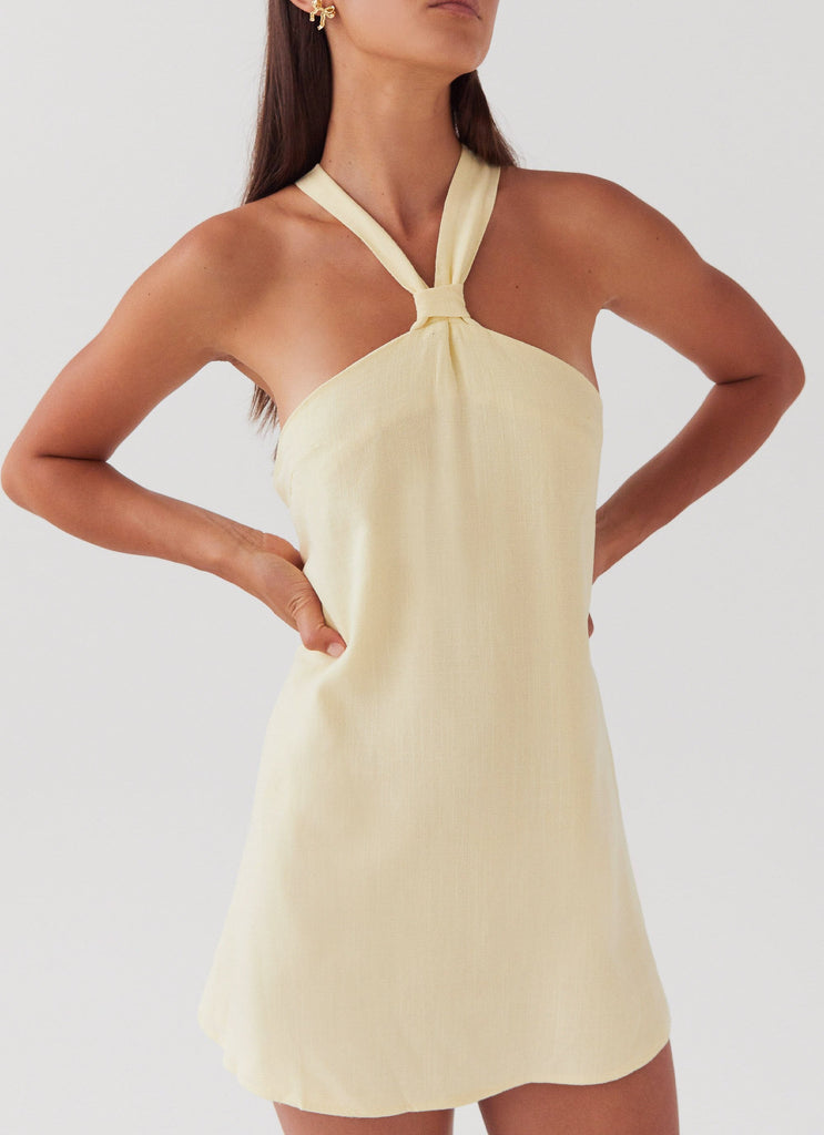 Womens Keira Linen Mini Dress in the colour Lemon in front of a light grey background