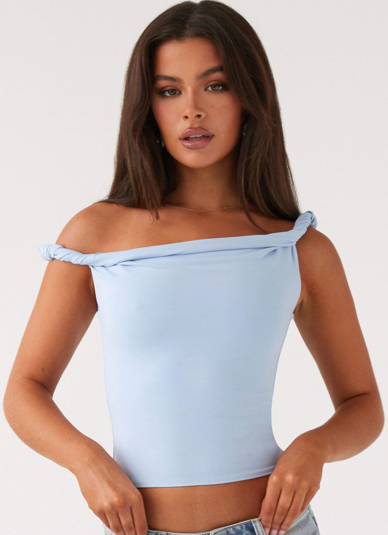 Womens Solace Soul Twist Shoulder Top in the colour Baby Blue in front of a light grey background