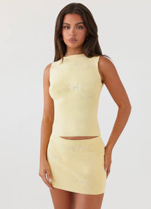 Womens Holly Knit Mini Skirt in the colour Lemon in front of a light grey background