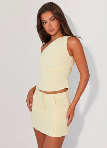 Womens Marissa Linen Mini Skirt in the colour Lemon in front of a light grey background