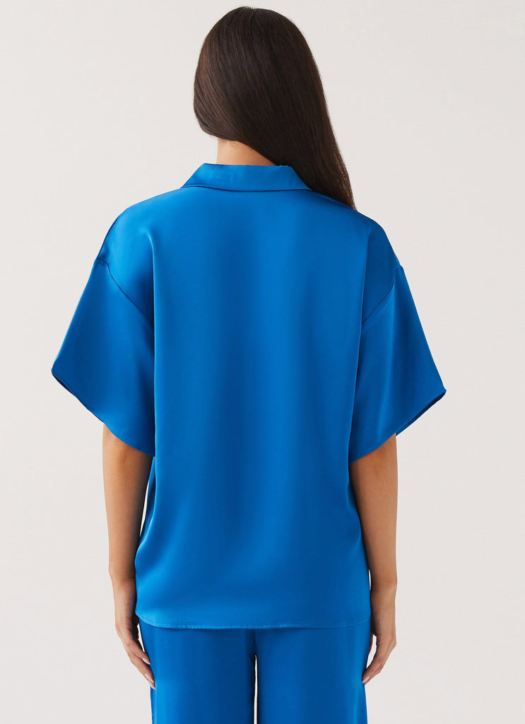 Womens Palm Cove Satin Shirt in the colour Cobalt in front of a light grey background