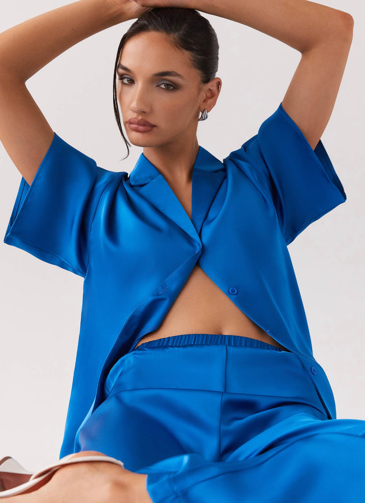 Womens Palm Cove Satin Shirt in the colour Cobalt in front of a light grey background