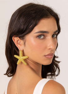 Womens Geneve Starfish Earring in the colour Gold in front of a light grey background