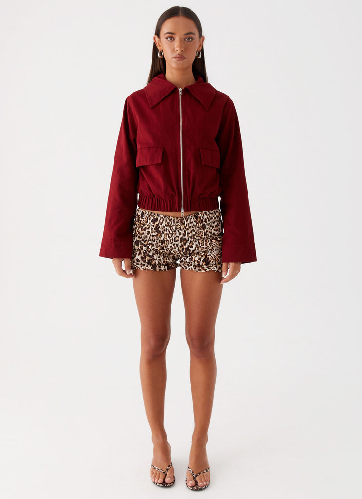 Womens Right Direction Oversized Bomber Jacket in the colour Deep Red in front of a light grey background