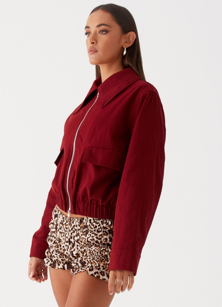 Womens Right Direction Oversized Bomber Jacket in the colour Deep Red in front of a light grey background
