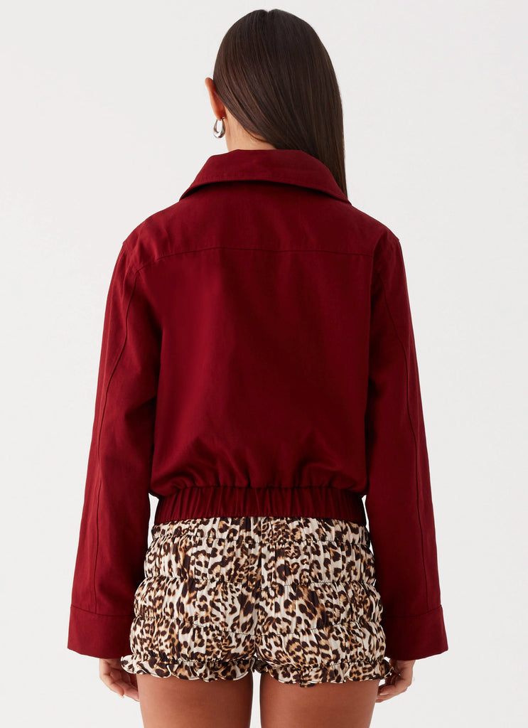 Womens Right Direction Oversized Bomber Jacket in the colour Deep Red in front of a light grey background