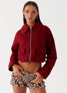 Womens Right Direction Oversized Bomber Jacket in the colour Deep Red in front of a light grey background