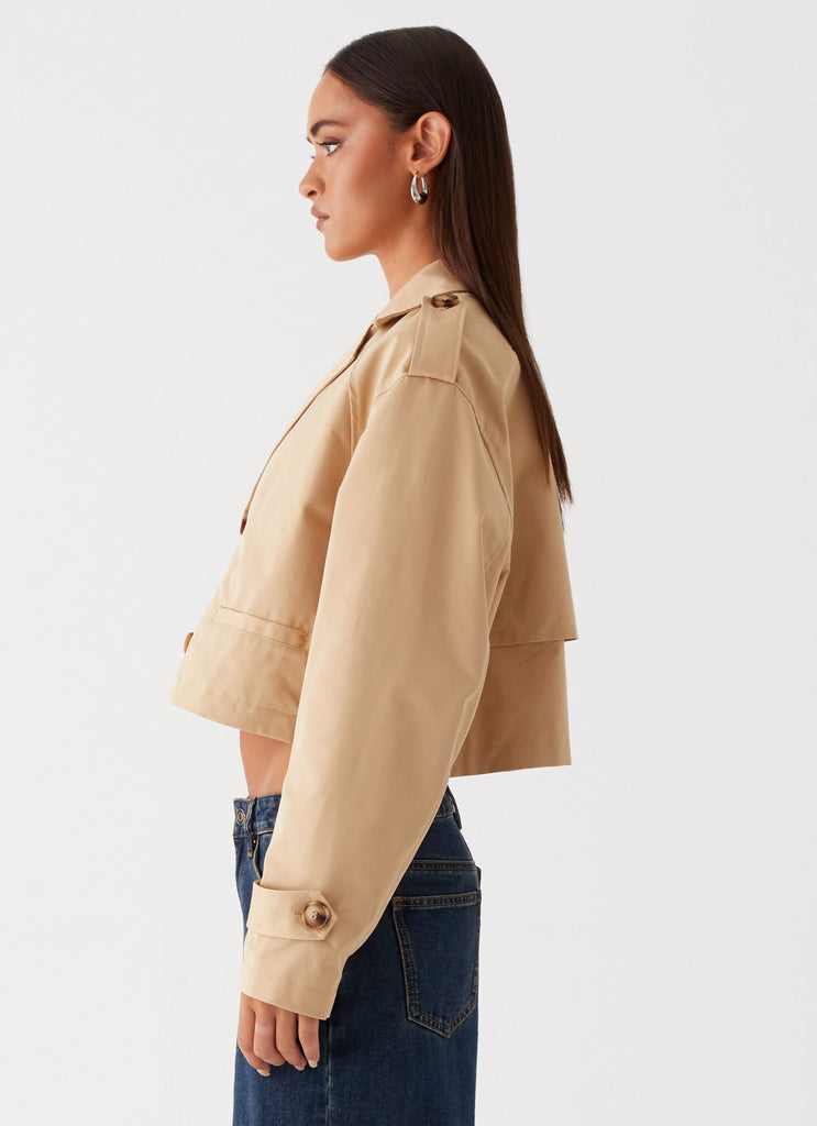 Womens Teddie Cropped Trench Coat in the colour Camel in front of a light grey background