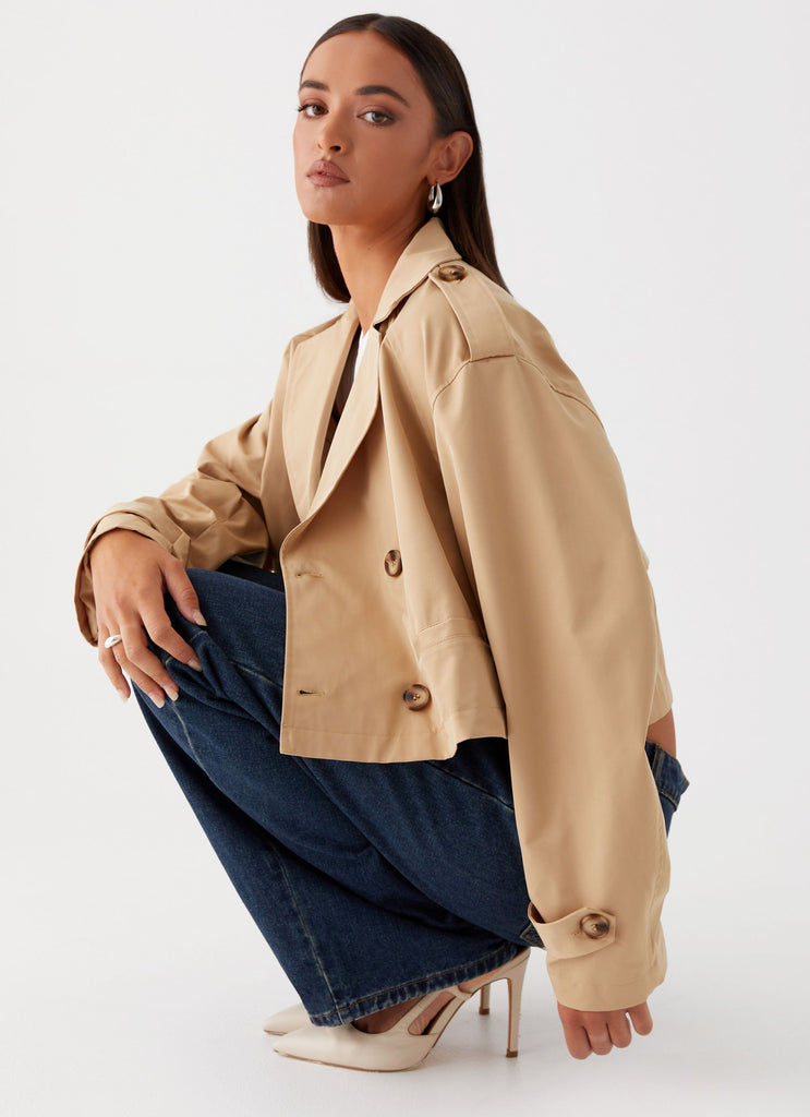 Womens Teddie Cropped Trench Coat in the colour Camel in front of a light grey background