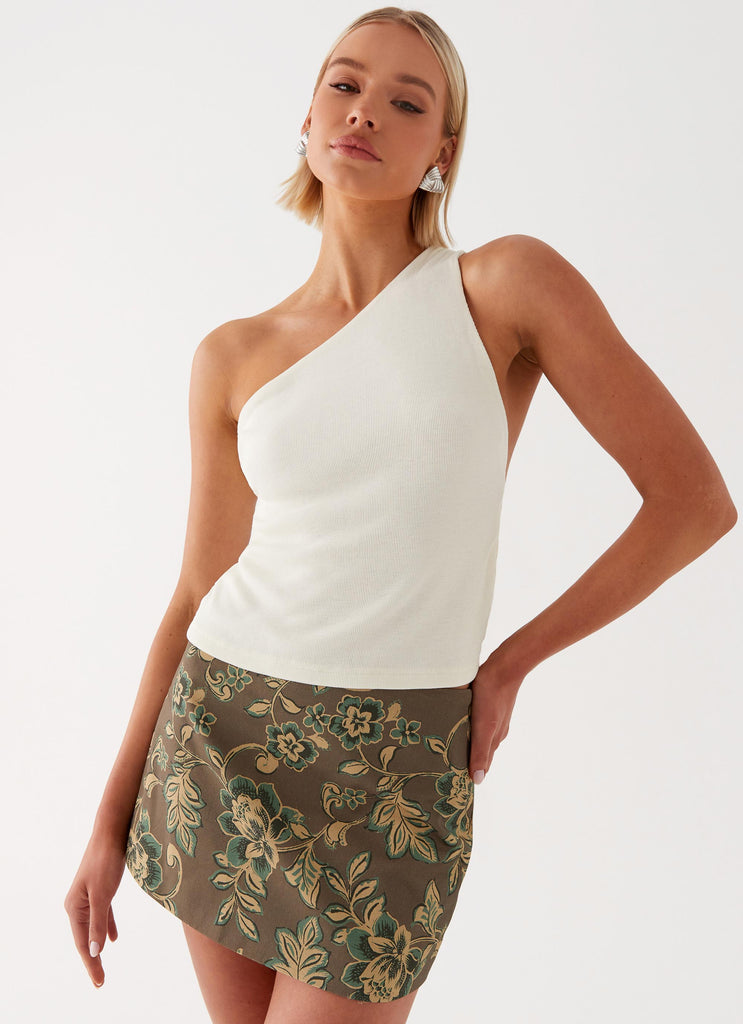 Womens Tonnie Floral Mini Skirt in the colour Brown Floral in front of a light grey background